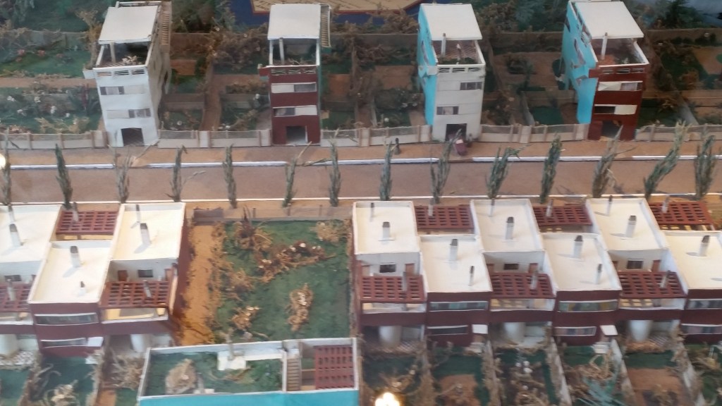 the push-me-pull-you style of terrace as shown in a model of the development, with skyscraper style at top